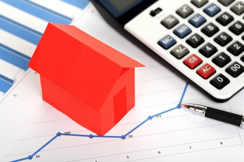 House model next to various stationary