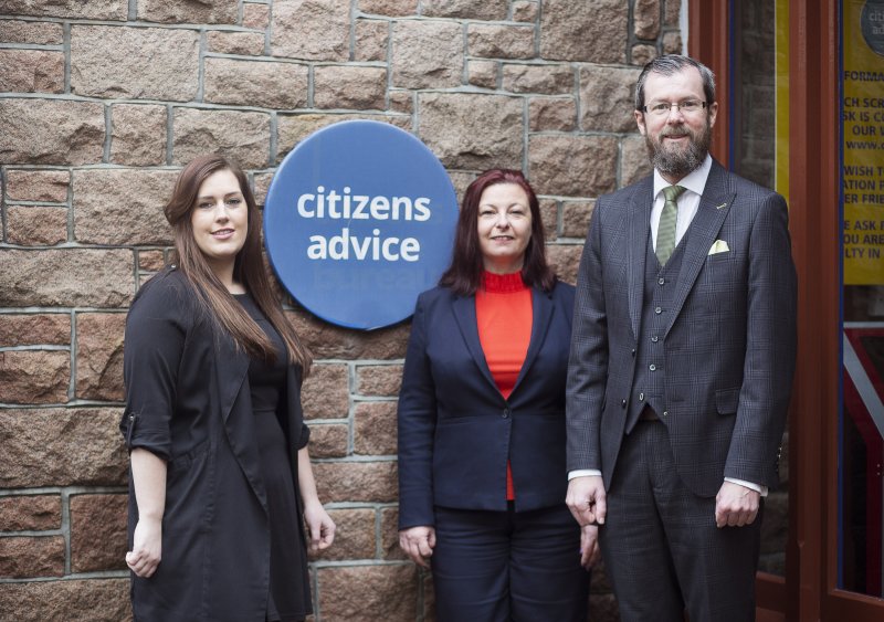 people smiling alongside an image of citizens advise