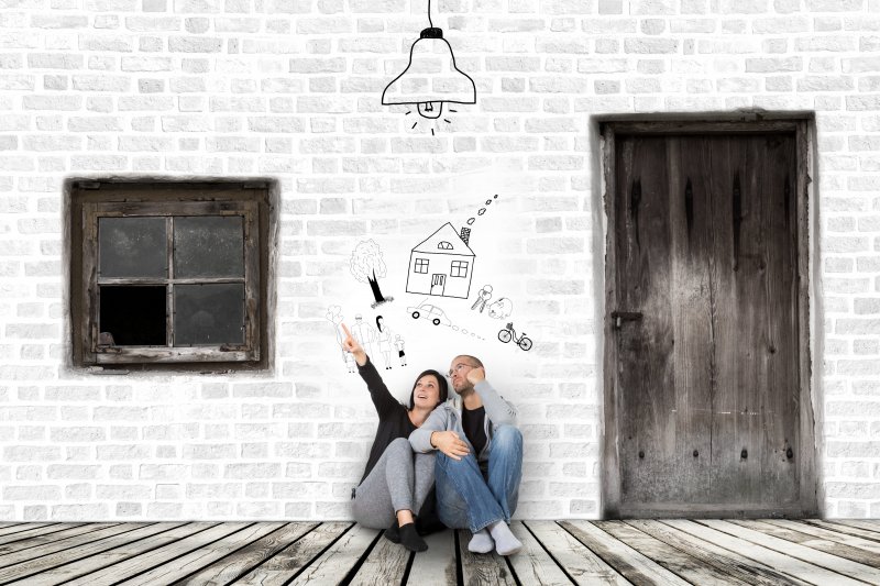 people sitting down in room dreaming of new house