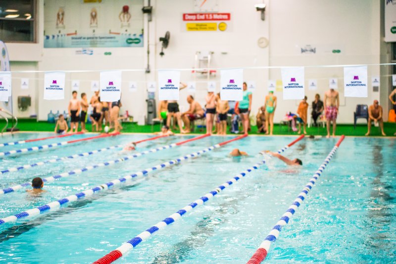 people in pool swimming in Skipton Swimarathon