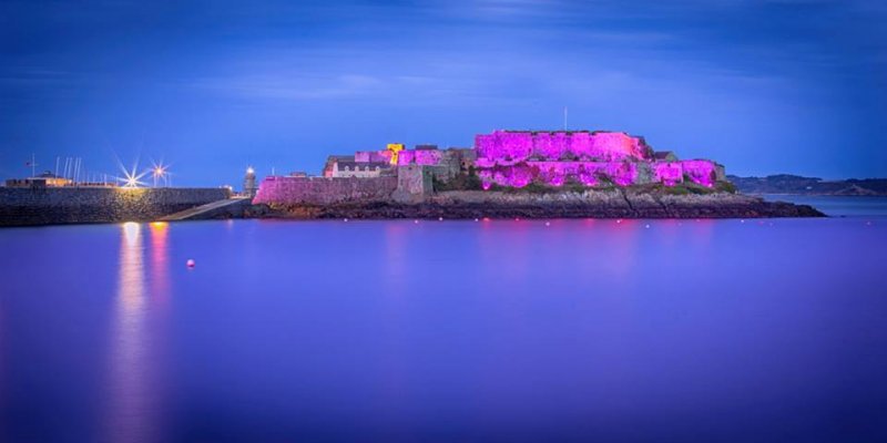 Castle Cornet lit up purple