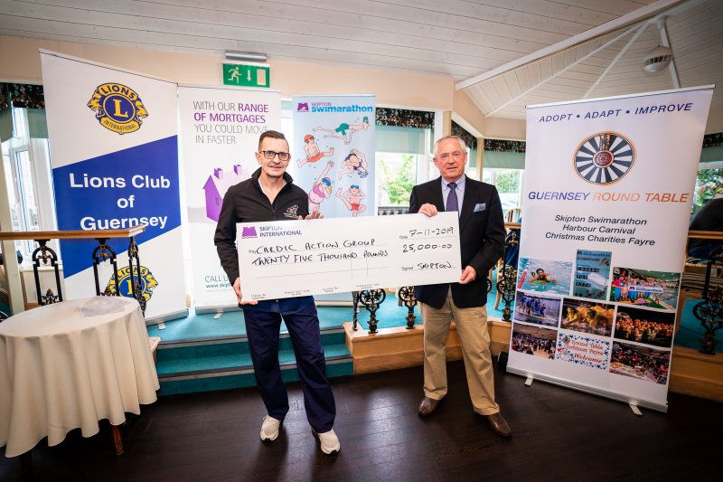 Skipton Swimarathon Beneficiaries holding large cheque