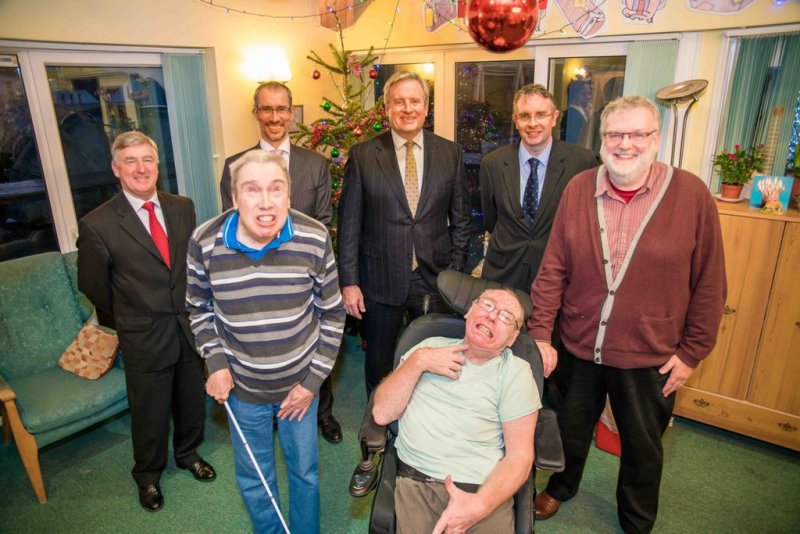 Group of men smiling