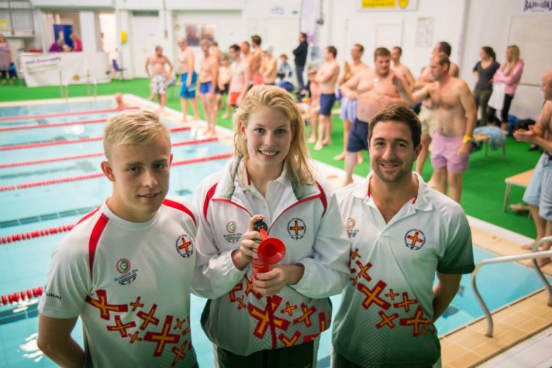 3 people in front of a pool
