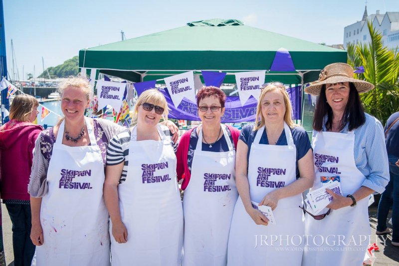 Women lined up smiling