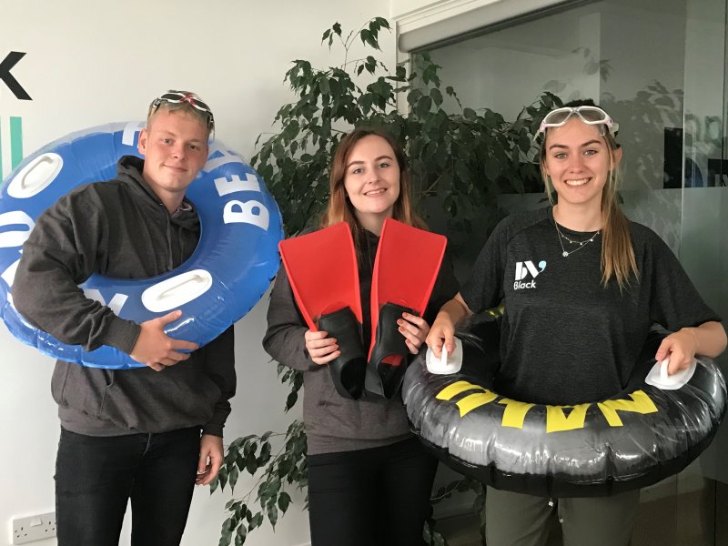 Young group with swimming equipment  